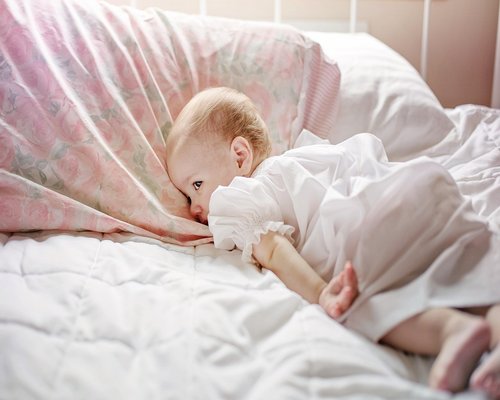 person comfortably sleeping in a cool room